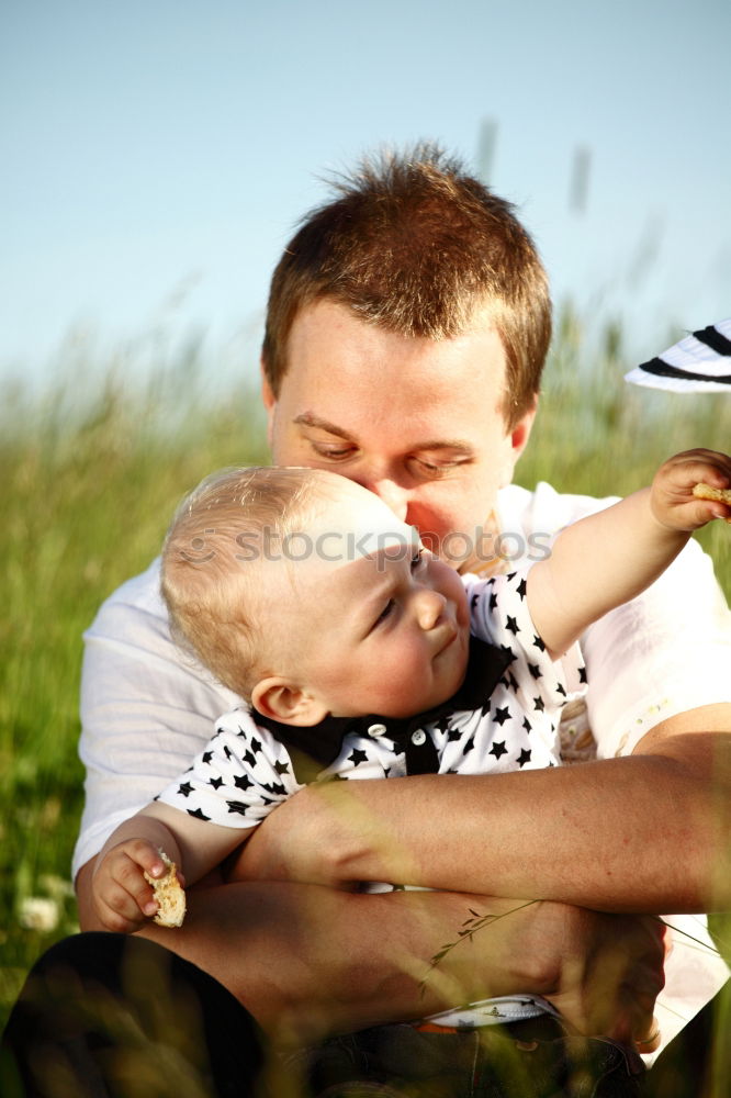 Similar – Image, Stock Photo Father and son playing at the park near lake at the day time.