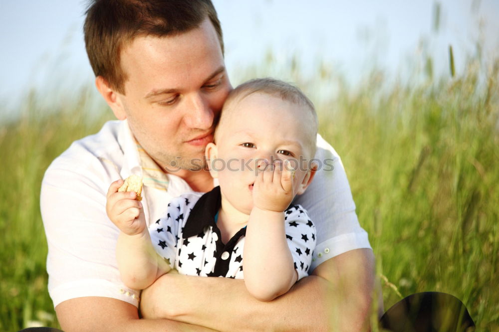 Similar – Image, Stock Photo young dad and son playing outdoors at sunset. family concept