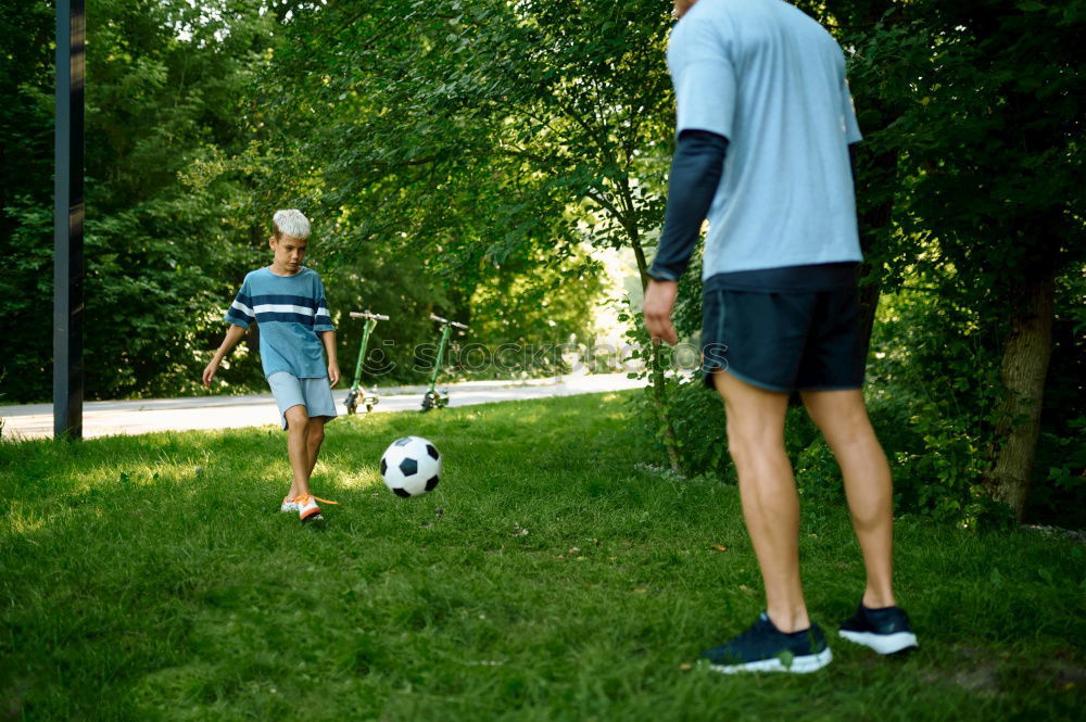 Similar – Boy playing football