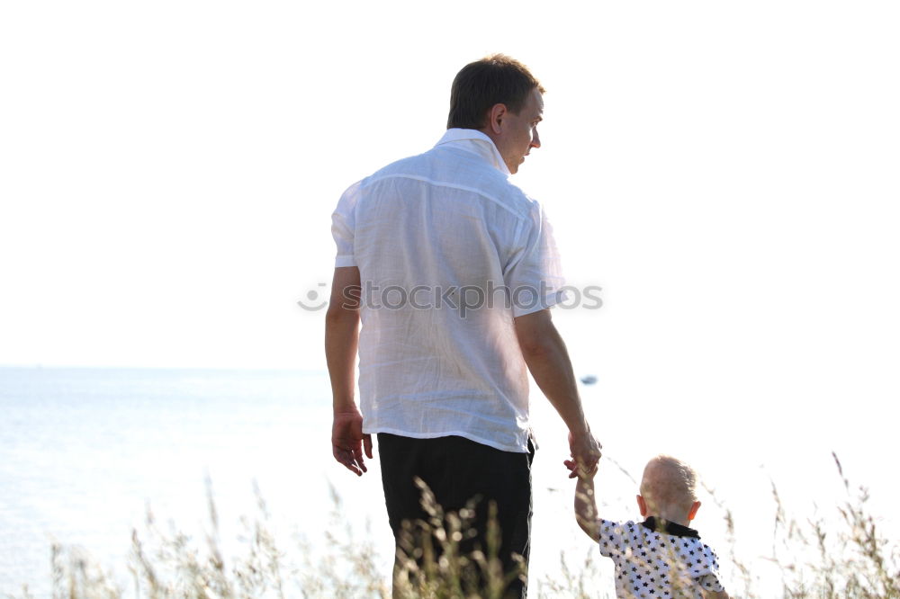 Similar – Image, Stock Photo Father and son playing on the beach