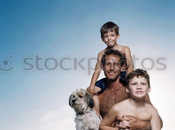 Similar – Image, Stock Photo Cute puppy licking face of young male adult