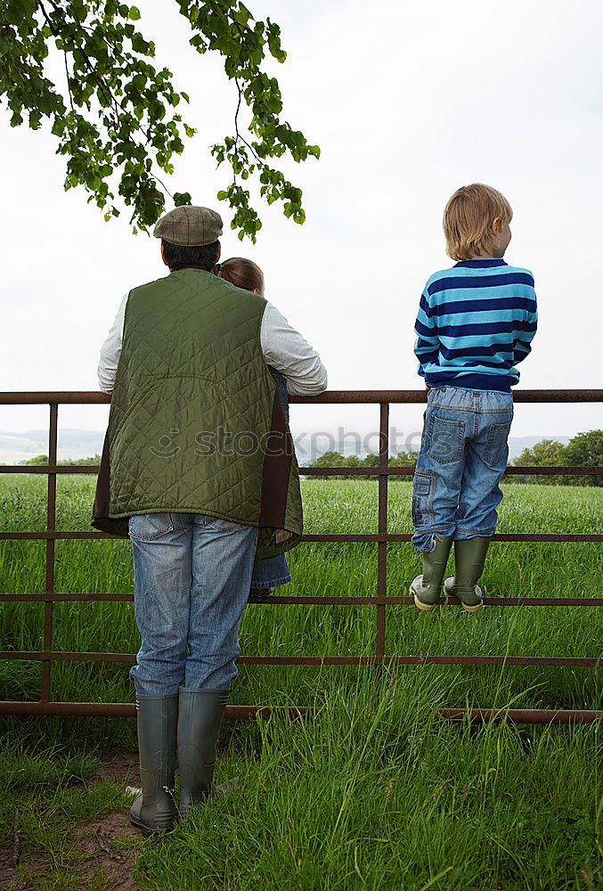 Similar – Granny sitting with her grandson on a meadow in nature