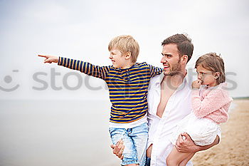 Similar – Image, Stock Photo Father and son playing on the beach at the day time.