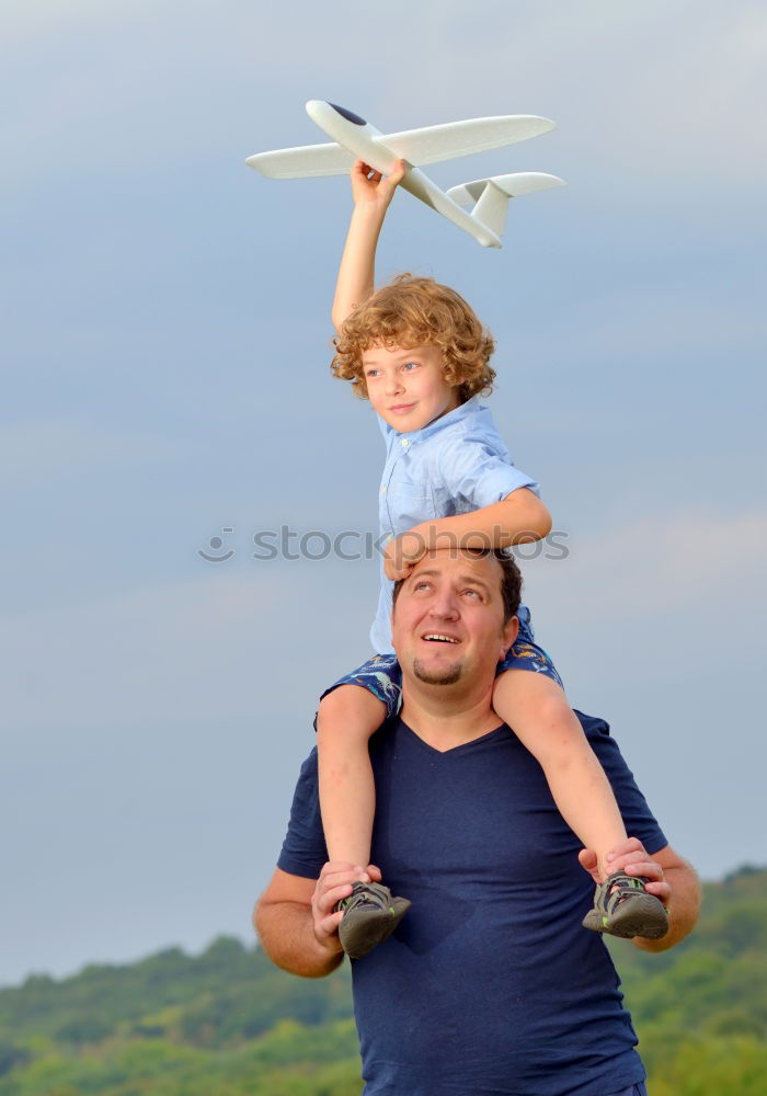 Similar – Father and son standing on the road at the day time.