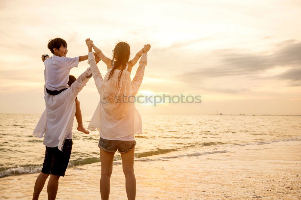 Similar – Father and son playing on the beach at the sunset time. Concept of friendly family.