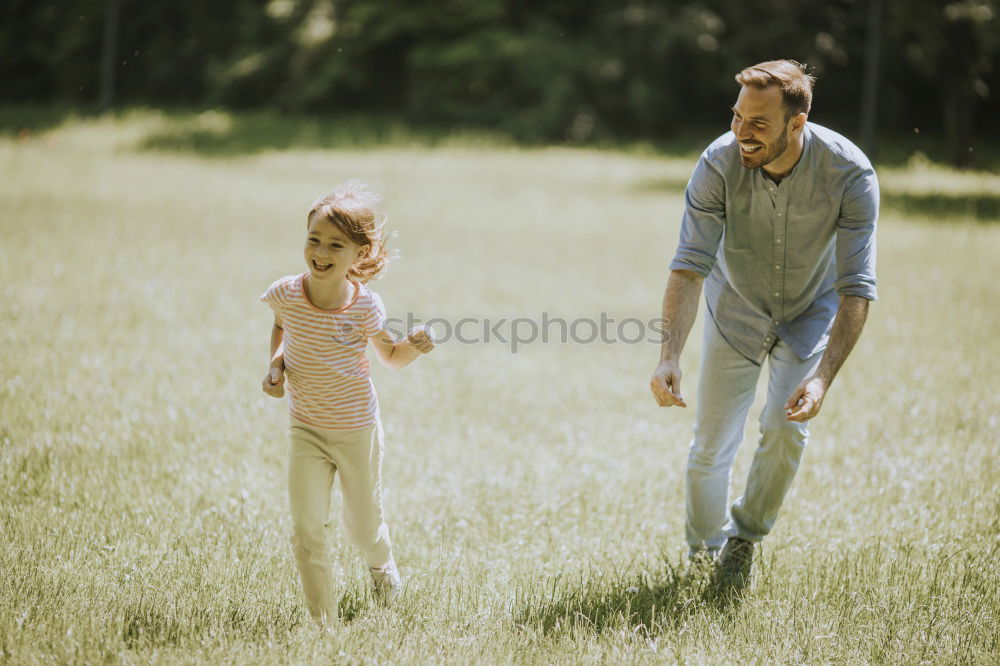 Similar – Image, Stock Photo Father and son playing at the park near lake at the day time.