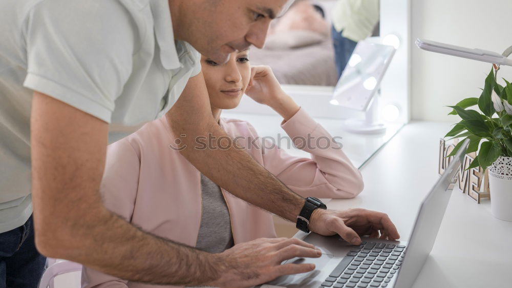 Similar – Two businessman meeting and using smartphone with laptop at outdoor cafe