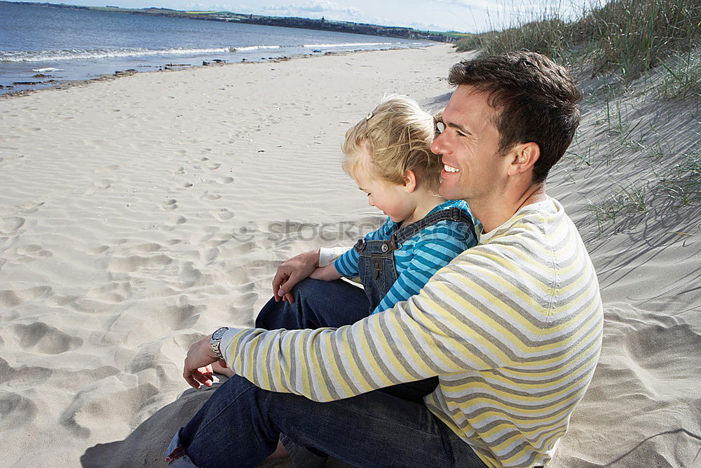 Similar – Image, Stock Photo Happy father and son playing on the beach at the day time. Concept of friendly family.