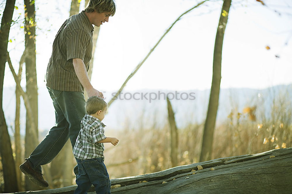 Similar – Image, Stock Photo Father and son playing at the park near lake at the day time.