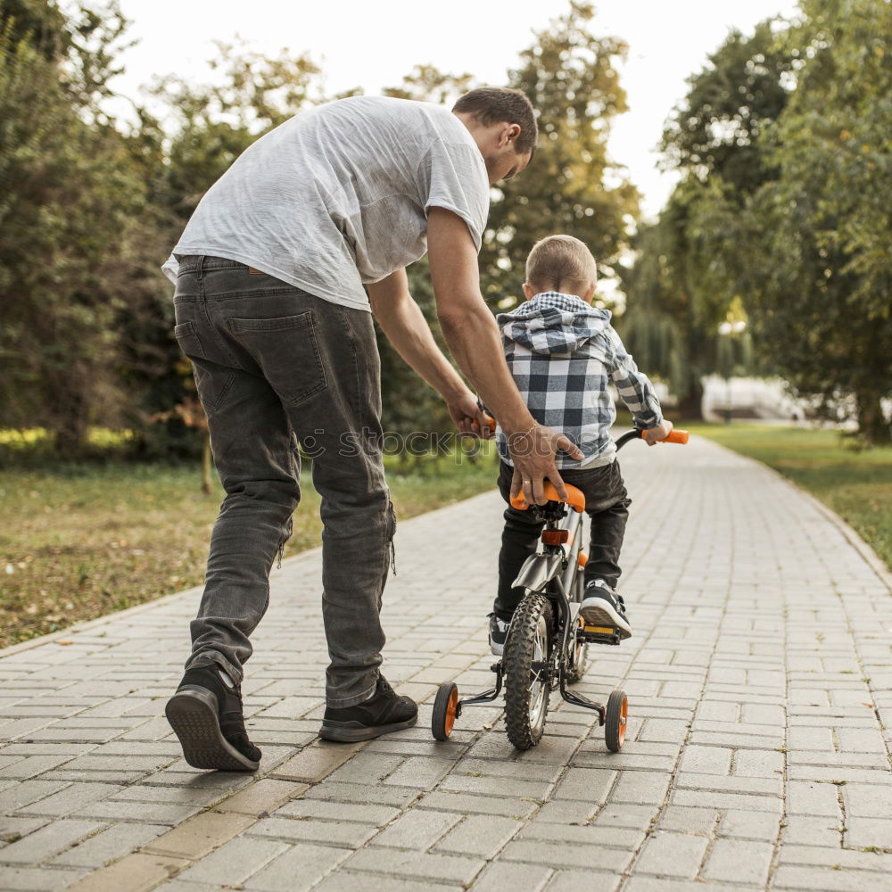 Similar – Image, Stock Photo Family with children riding bicycles in the nature