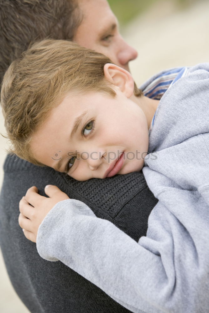 Similar – sad son hugging his mother at home. Concept of couple family is in sorrow.