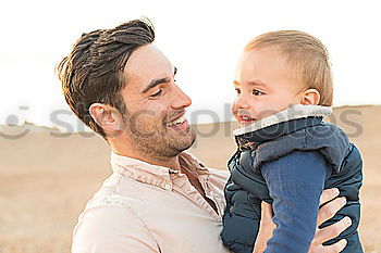 Similar – Image, Stock Photo A father with his baby in his arms