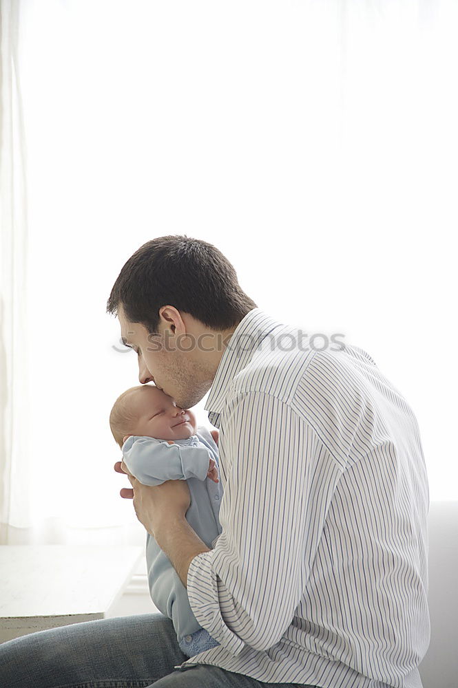 Similar – Image, Stock Photo Man kissing to peaceful newborn lying over bed