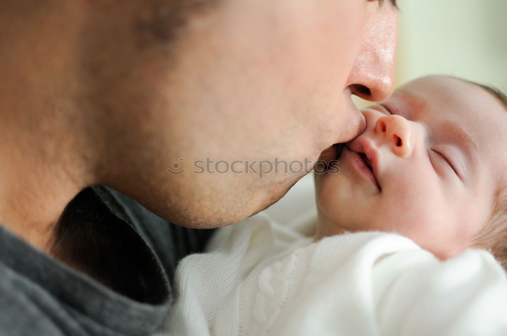 Similar – Image, Stock Photo Father kissing his newborn baby girl.