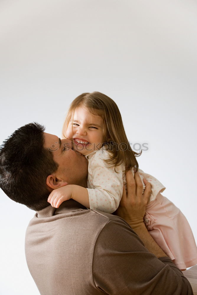 Similar – Father and daughter playing at home. Little girl closing dads eyes with hands and laughing. Family fun together