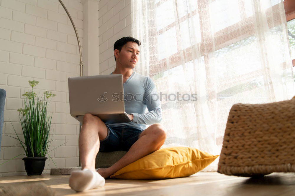 Similar – Mature woman sitting on couch at modern home