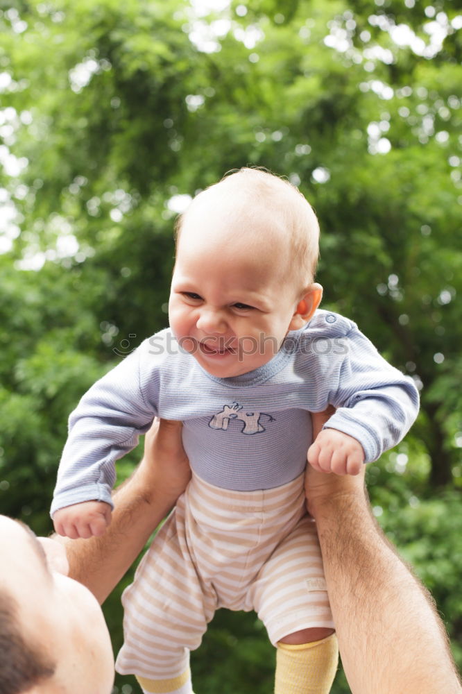 Similar – Image, Stock Photo A father with his baby in his arms