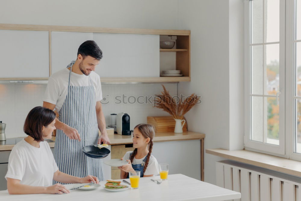 Similar – Image, Stock Photo little african girl is helping her mum preparing cupcake dough