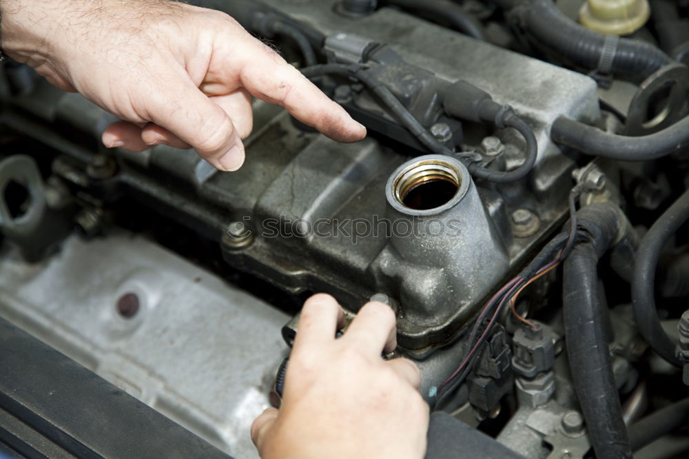 Similar – Professional Mechanic Repairing Car.