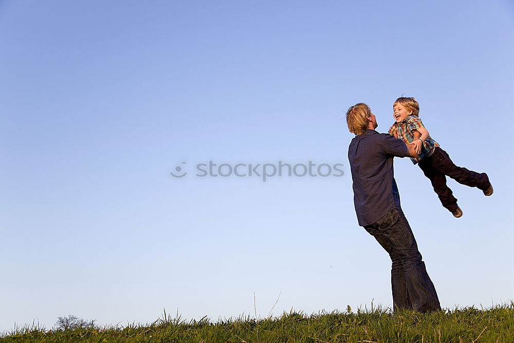 Similar – Image, Stock Photo Father and son playing on the beach at the day time. They are dressed in sailor’s vests. Concept of sailors on vacation and friendly family.