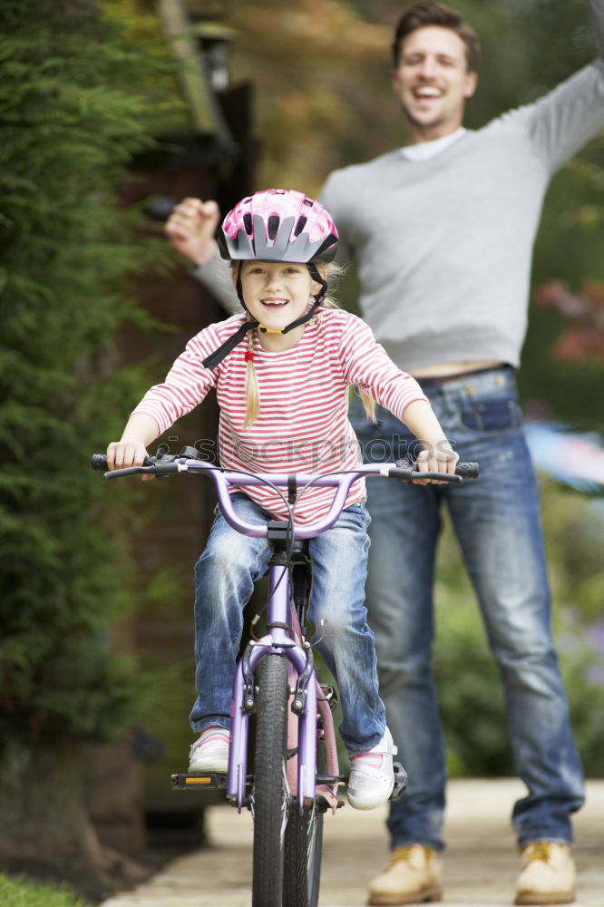 Similar – Father and daughter playing on the road at the day time.