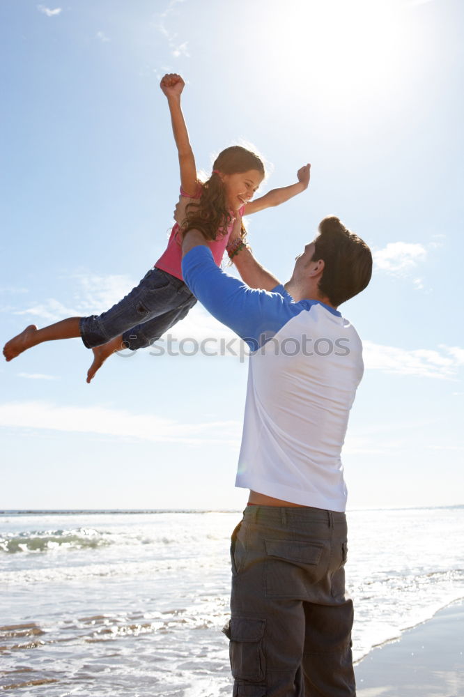 Similar – Image, Stock Photo Father and son playing on the beach at the day time. People having fun outdoors. Concept of summer vacation and friendly family.