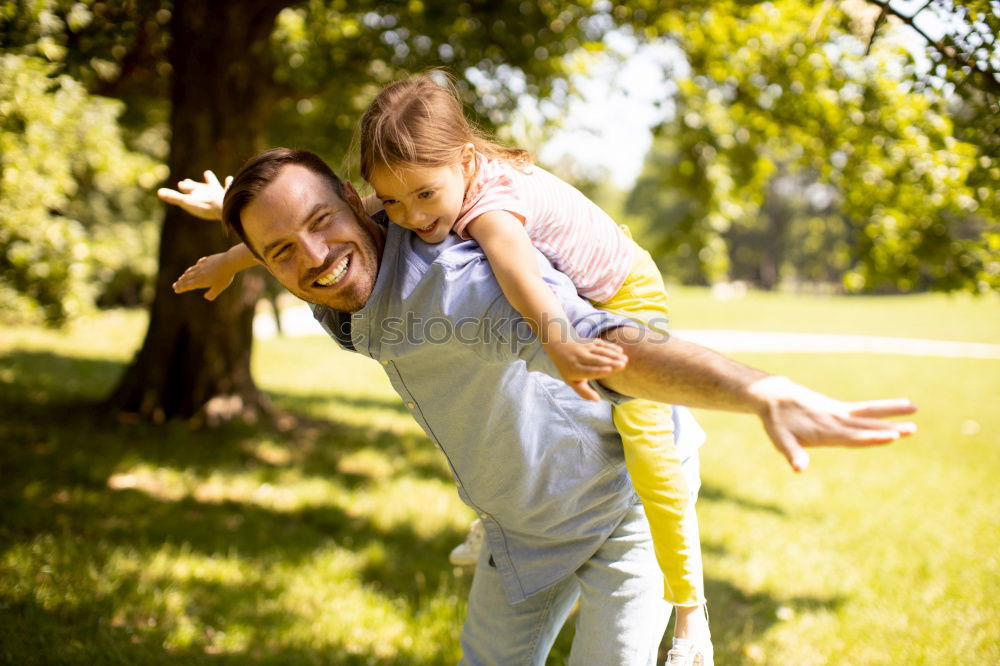 Similar – Image, Stock Photo Grandfather putting shoe to his grandson outdoors