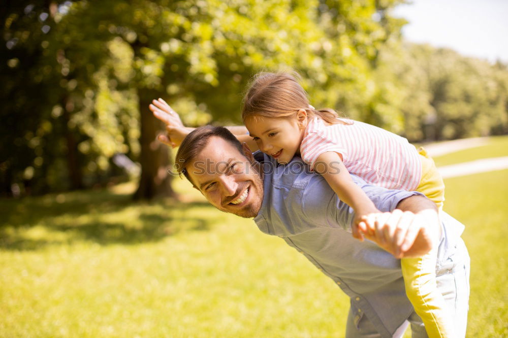 Similar – Image, Stock Photo Father and son relaxing near the house at the day time. They sitting near are the colorful wall. Concept of friendly family.