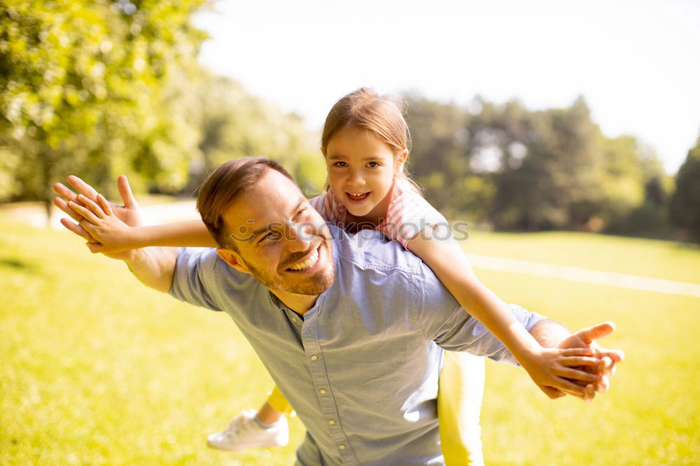 Similar – Image, Stock Photo Father and son relaxing near the house at the day time. They sitting near are the colorful wall. Concept of friendly family.