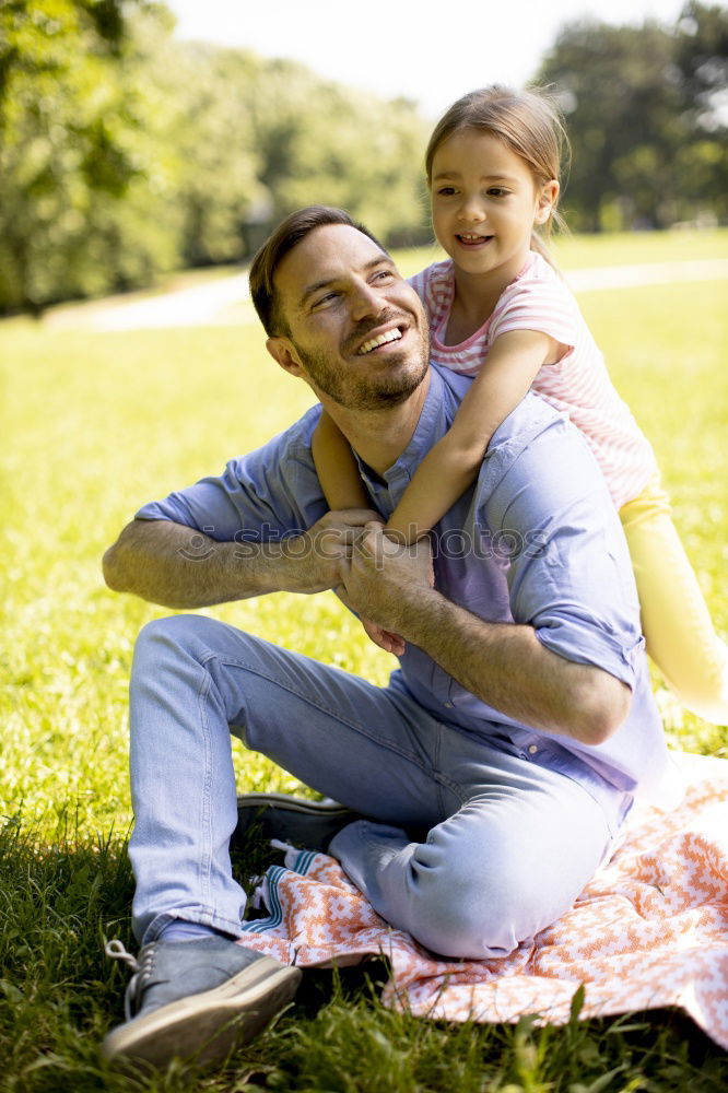 Similar – Image, Stock Photo Father and son playing at the park on bench at the day time.