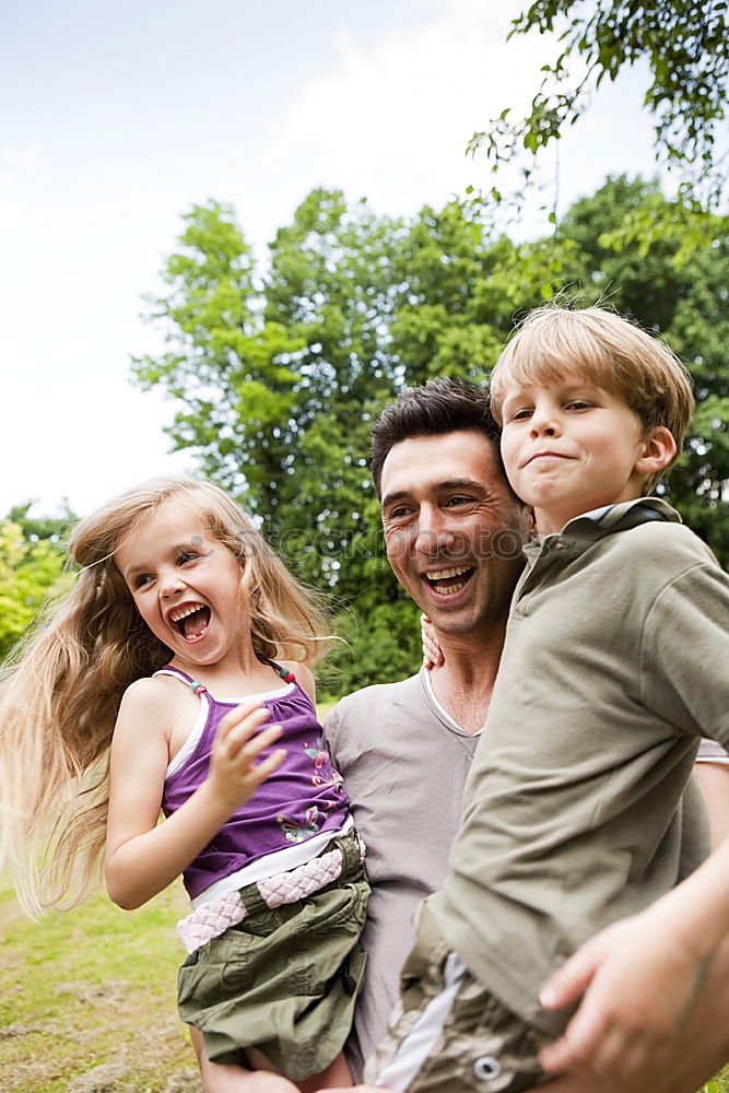 Similar – Image, Stock Photo Father and children walking on the road at the day time.