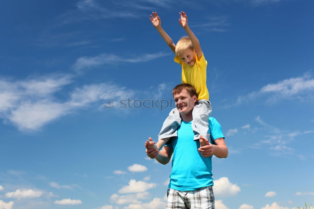 Similar – Image, Stock Photo Father and son walking on the road at the day time. People having fun outdoors. Concept of friendly family.