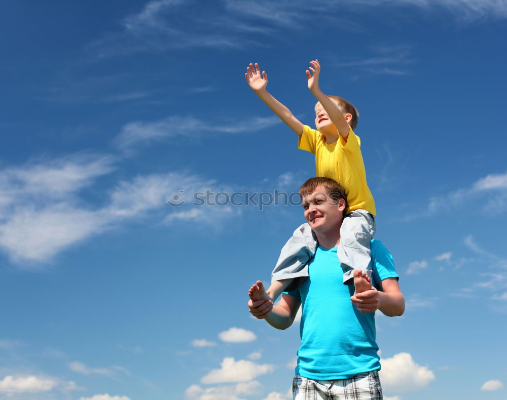 Similar – Image, Stock Photo Father and son walking on the road at the day time. People having fun outdoors. Concept of friendly family.