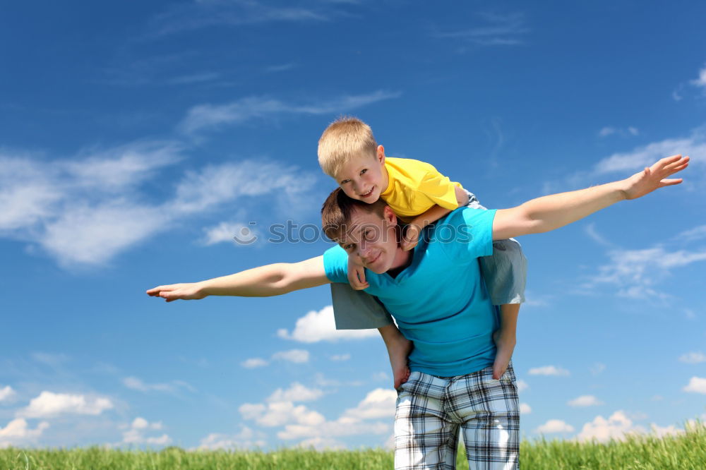 Similar – Father and son playing in the park at the day time.