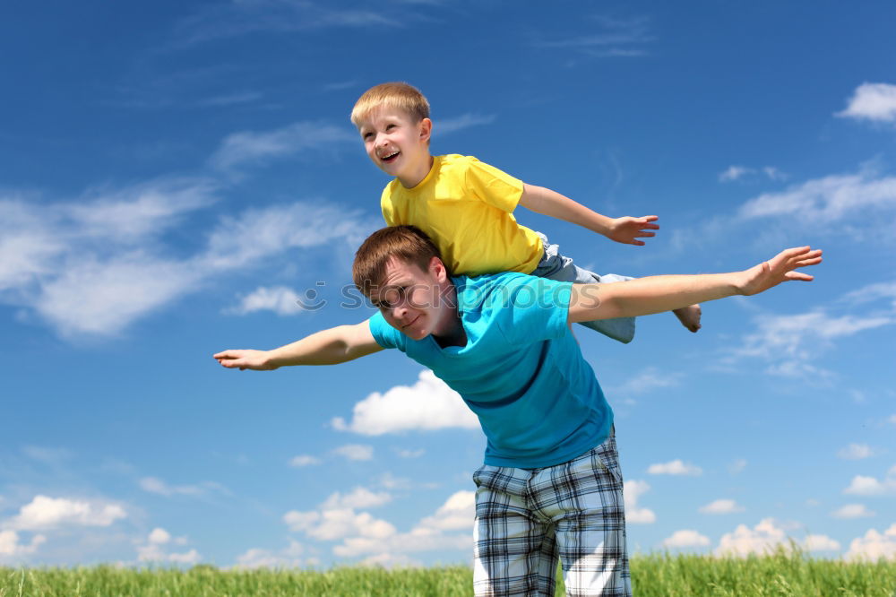 Similar – Father and son standing on the road at the day time.