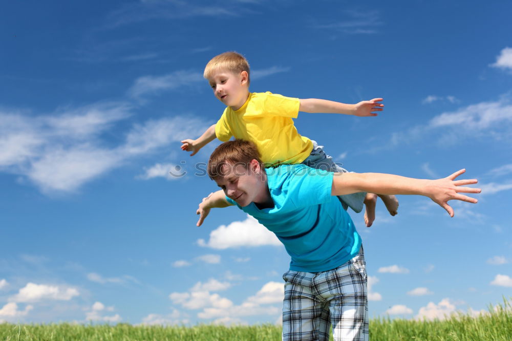 Similar – Image, Stock Photo Father and son playing in the park at the day time. Concept of friendly family. Picture made on the background of blue sky.