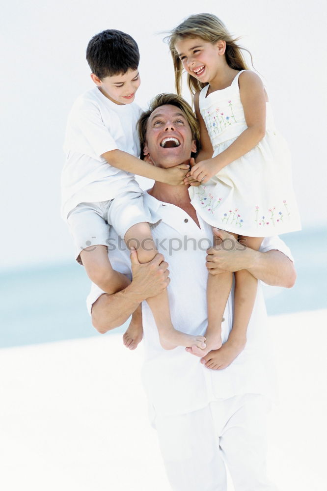 Similar – Father and children playing on the beach at the day time. Concept of friendly family.