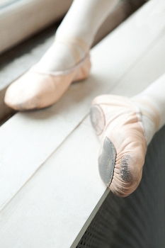 Similar – Ballerina laces up her pointe shoes