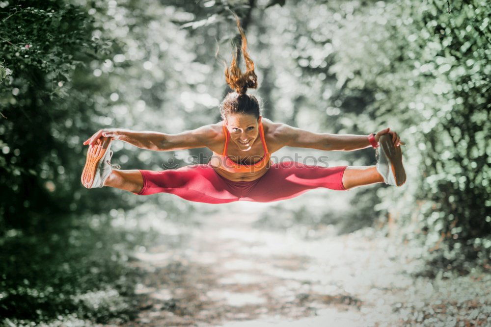 Similar – Image, Stock Photo Strong white woman jumping in the air during contemporary dance performing.