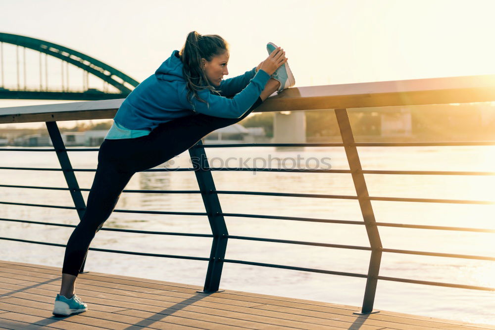 Similar – Young black woman doing stretching after running outdoors