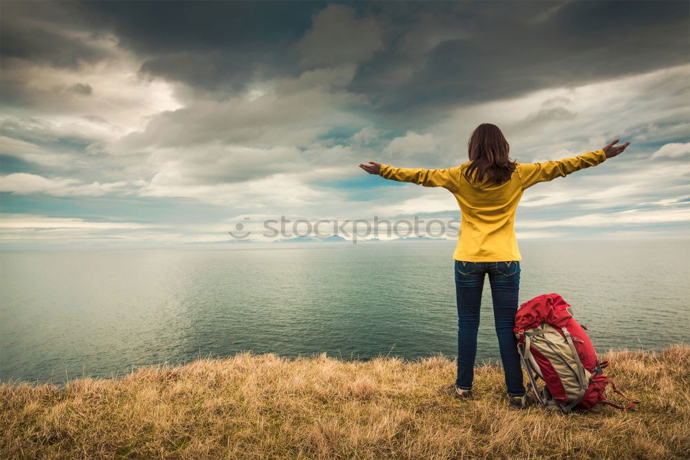 Similar – Image, Stock Photo Person in coat with camera near lake