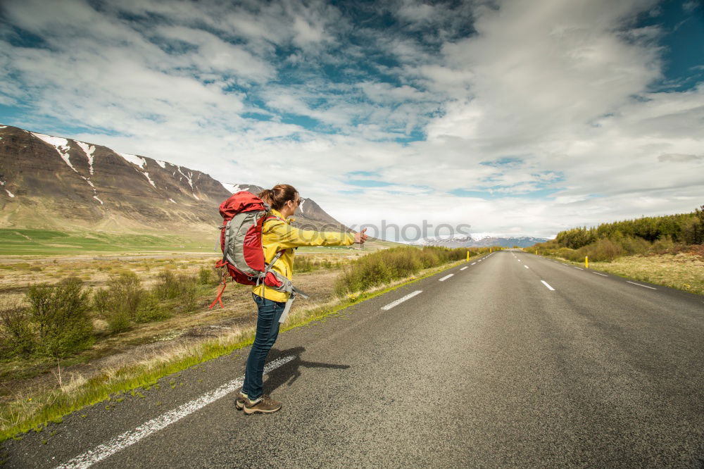 Similar – Image, Stock Photo jumping woman on a country road with mountains in the background