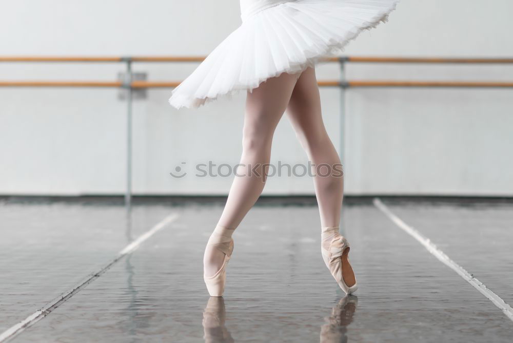 Similar – Elegante Ballerina in weißem Kleid tanzt gegen eine rustikale Wand