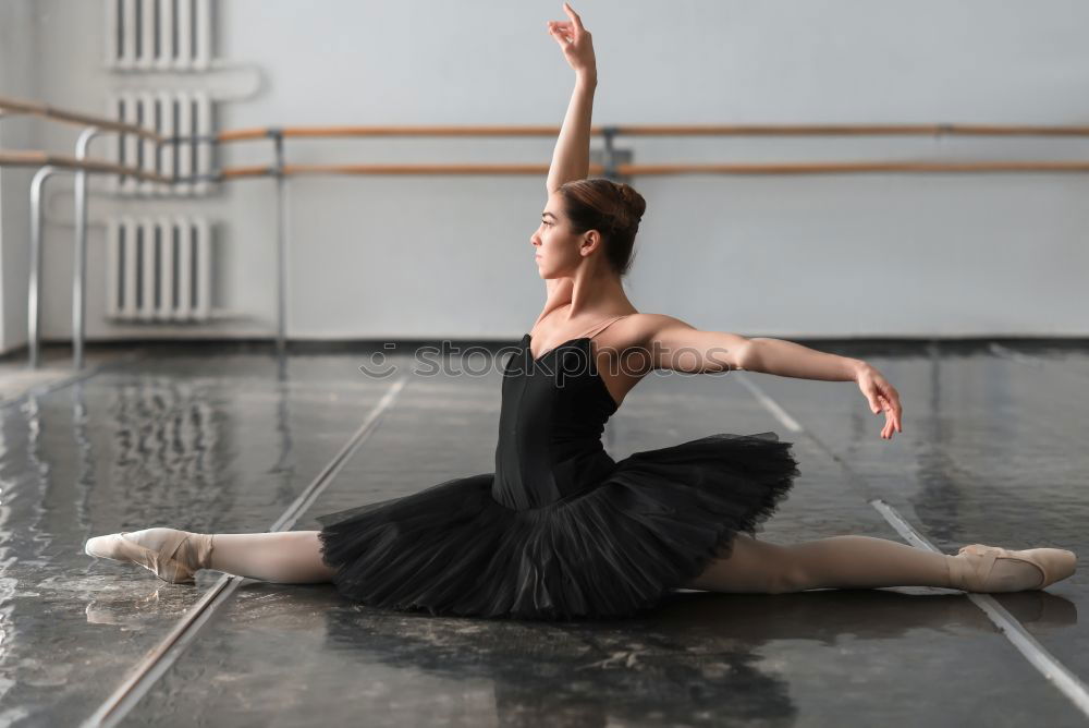 Similar – Top view at ballet dancer tying slippers around her ankle