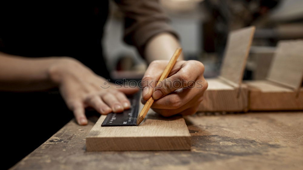 Similar – Craftsman working in his workshop wooden boxes