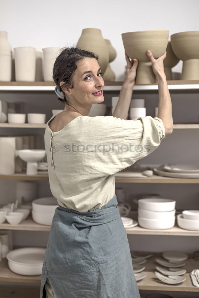 Similar – Image, Stock Photo Beautiful ceramist owner looking to the camera while smiling
