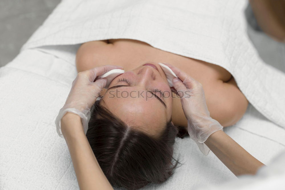 Similar – Image, Stock Photo Woman receiving massage on shoulders in clinical center