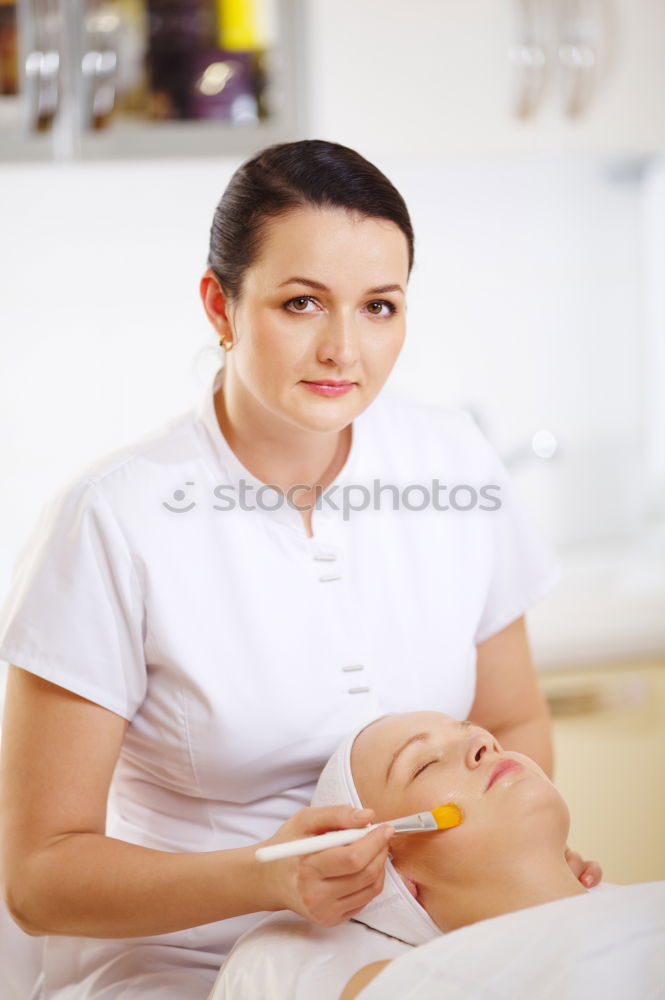 Similar – Professional cosmetician applying a facial mask with cosmetic brush