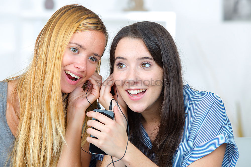 Similar – Image, Stock Photo Women at home sitting on sofa while using a tablet PC