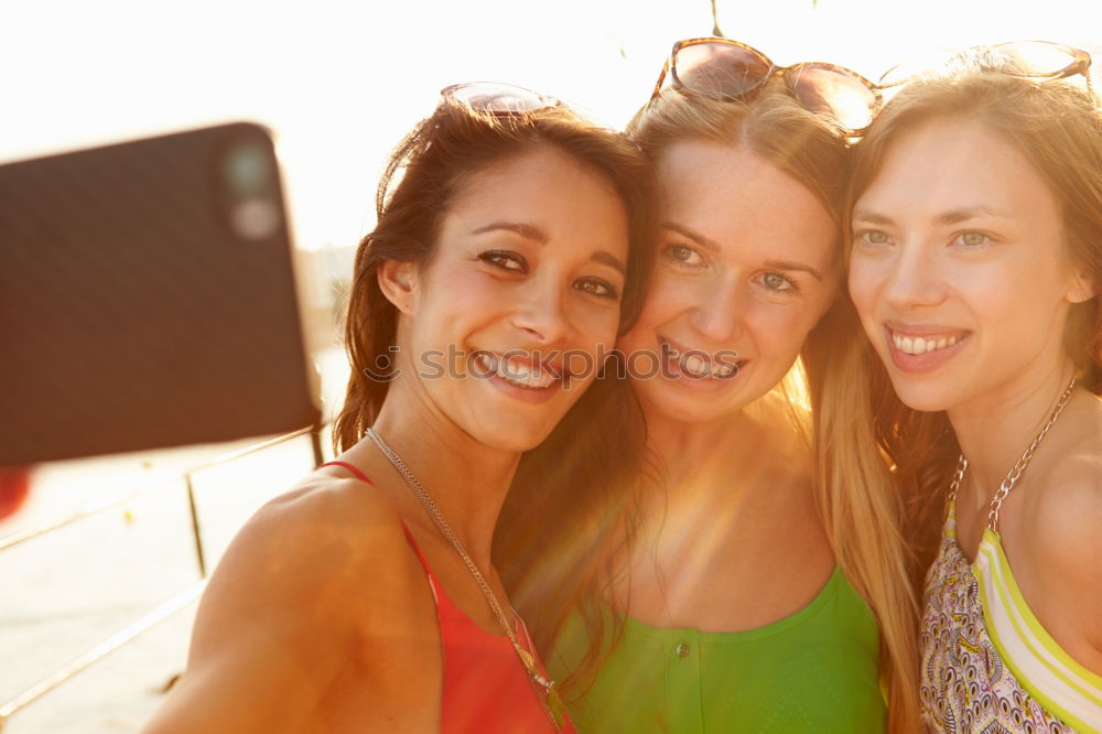 Similar – Beautiful women taking a selfie portrait in the park.